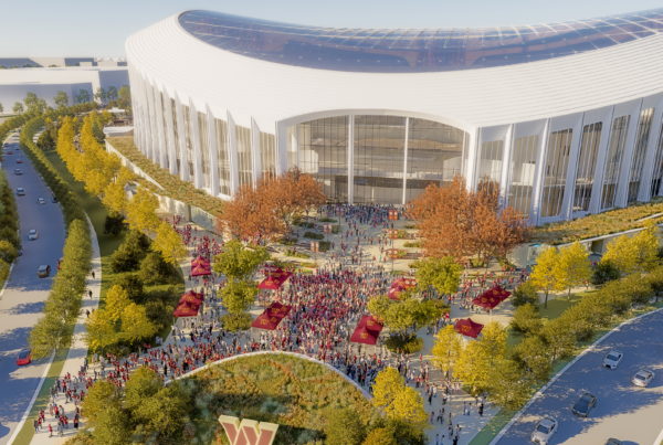 Aerial view of the Washington Commanders stadium east plaza, with tree-lined approaches and fan gatherings in a public realm landscape designed by OJB.